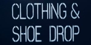 Clothing and shoe drop sign.