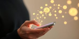 Person holding phone, digital currency flowing around
