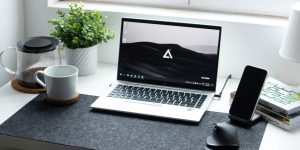 macbook pro on black table