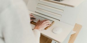 a person is typing on a computer keyboard